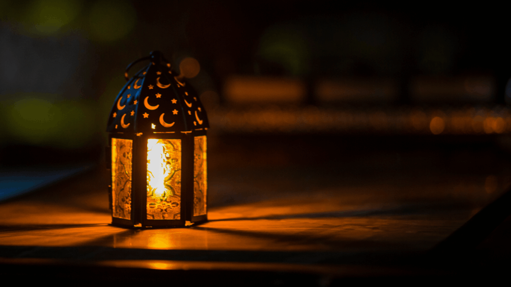 candlelit lantern shining in a dark background